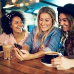women looking at a phone