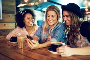 women looking at a phone